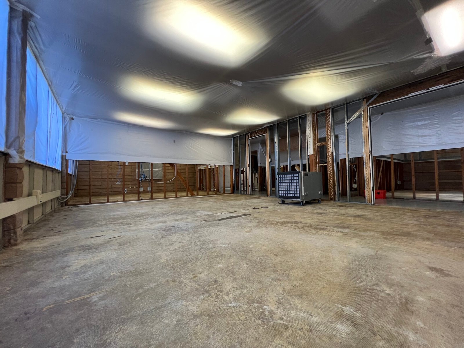 Interior of a property prepared with containment sheeting during a building materials project