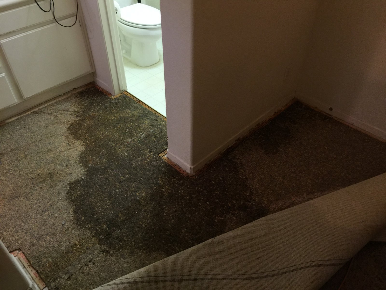 Water-damaged flooring lifted during an inspection of a Southern California property